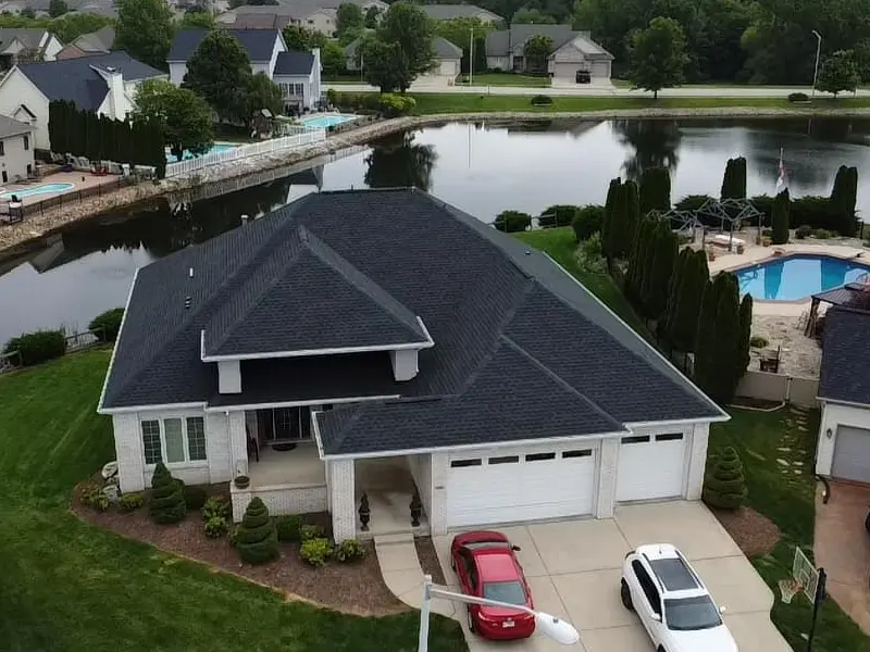 Home with new black roof shingles installed